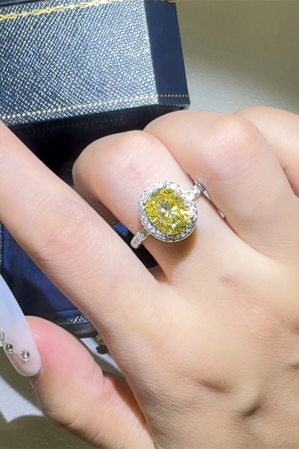 Yellow diamond halo ring in 925 silver with a bright canary diamond center.
