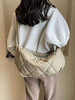 Quilted crossbody bag in khaki with diamond stitching and a slouchy silhouette.