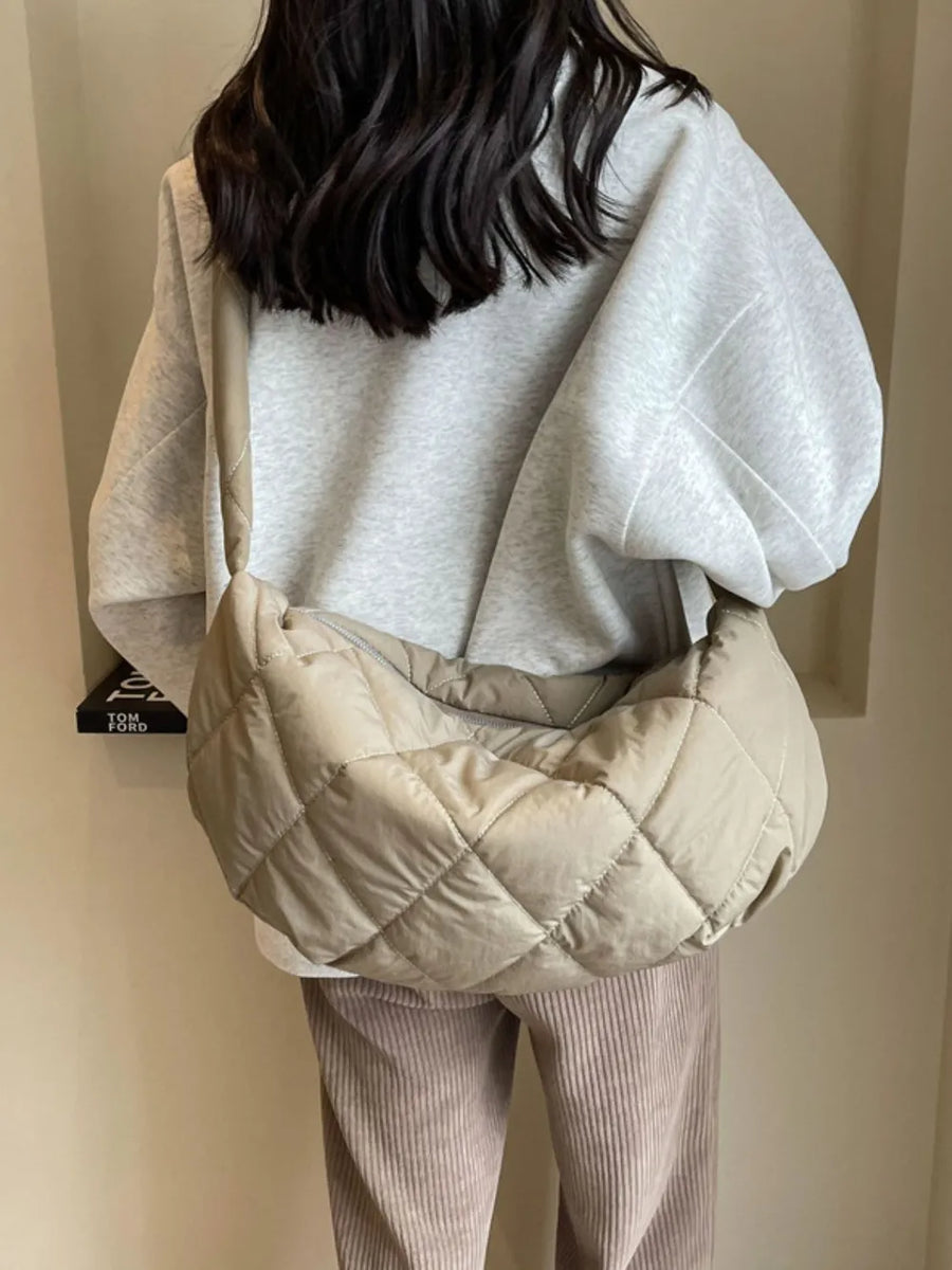 Quilted crossbody bag in khaki with diamond stitching and a slouchy silhouette.