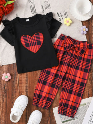 Black baby set with ruffled sleeves, plaid heart appliqué, and matching plaid pants with bow