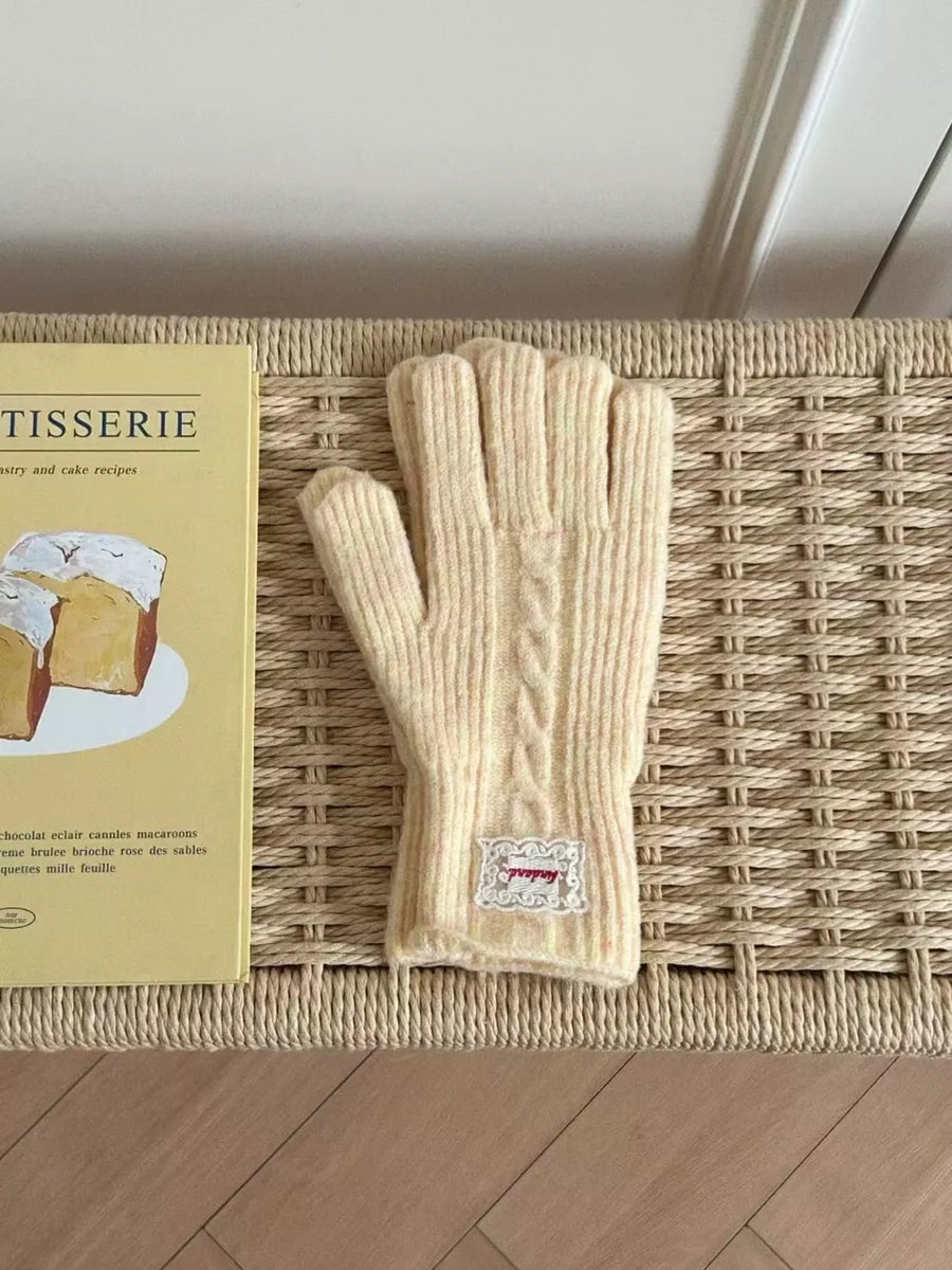 Luxurious cable knit gloves in yellow acrylic with a decorative patch detail.