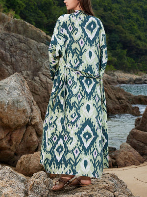 Green boho print maxi beach cover-up with a tie waist and open front.