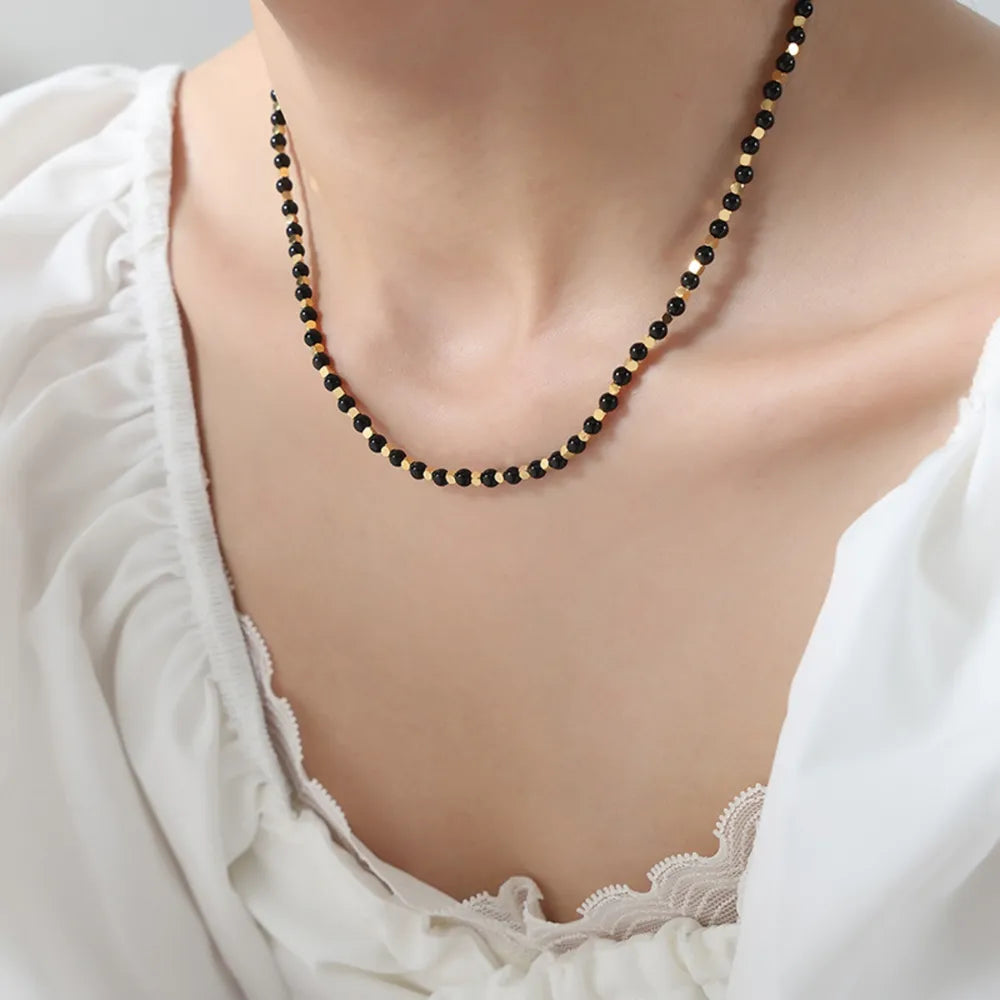 Black onyx and gold bead necklace with 18K gold accents.