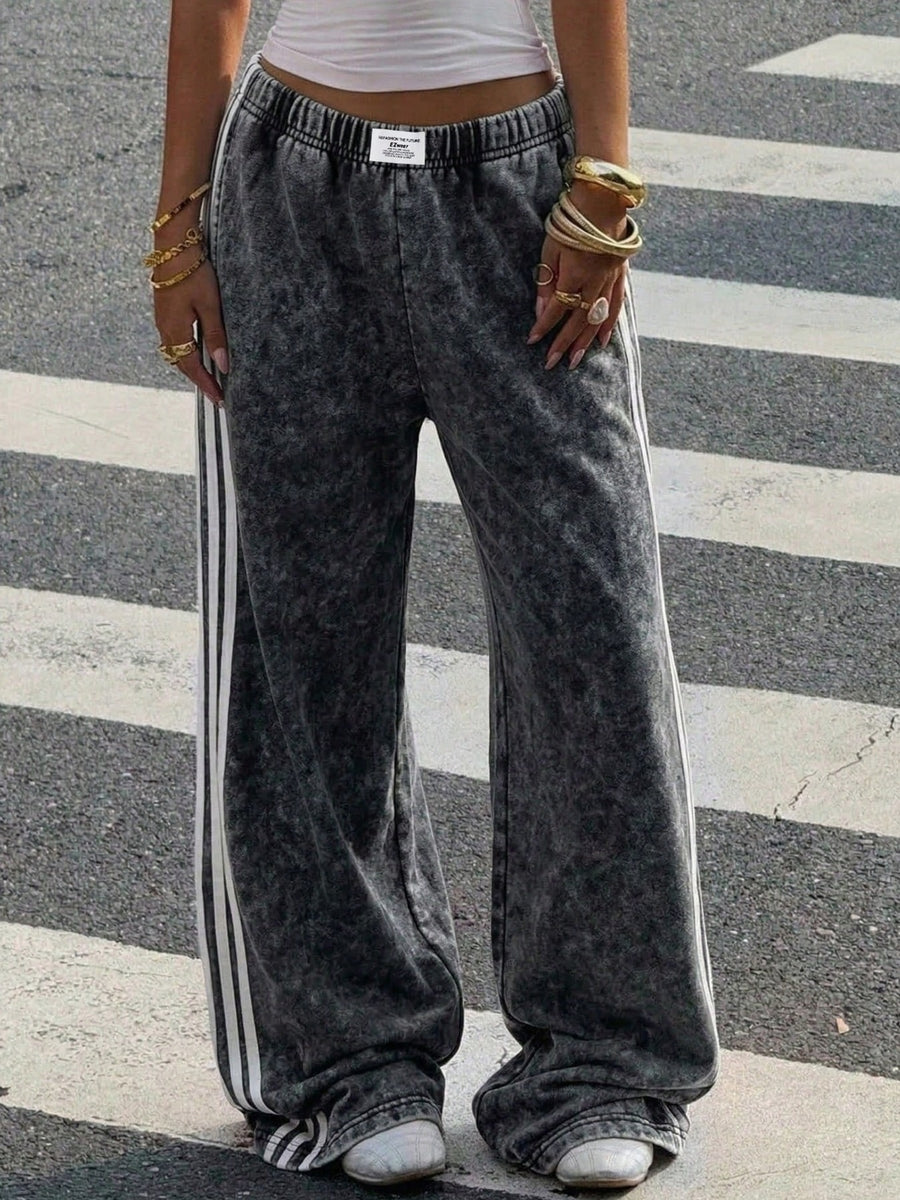 track pants featuring striped in White with 100% polyester Care instructions: Machine wash cold texture