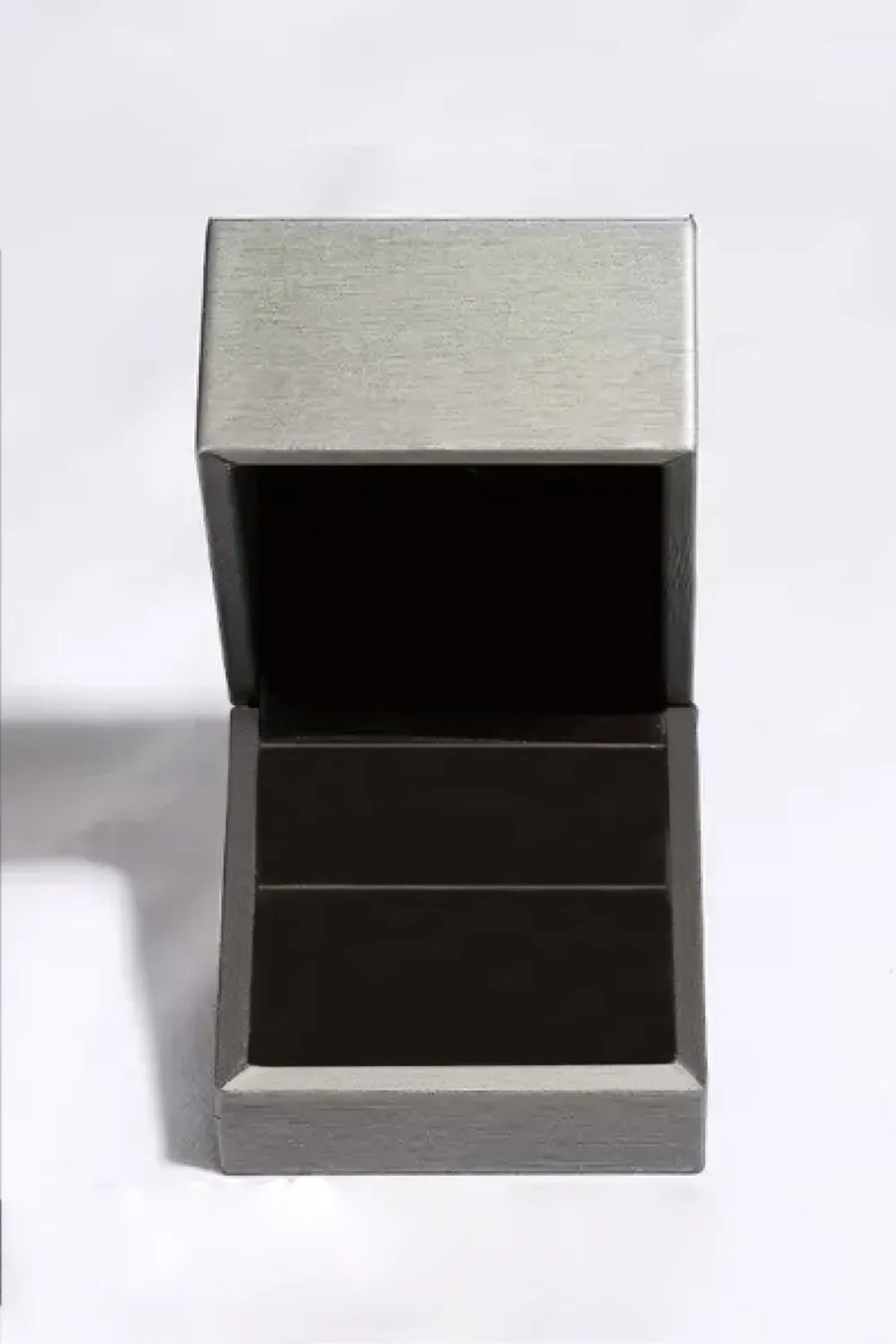 Silver jewelry box with open lid and dark interior