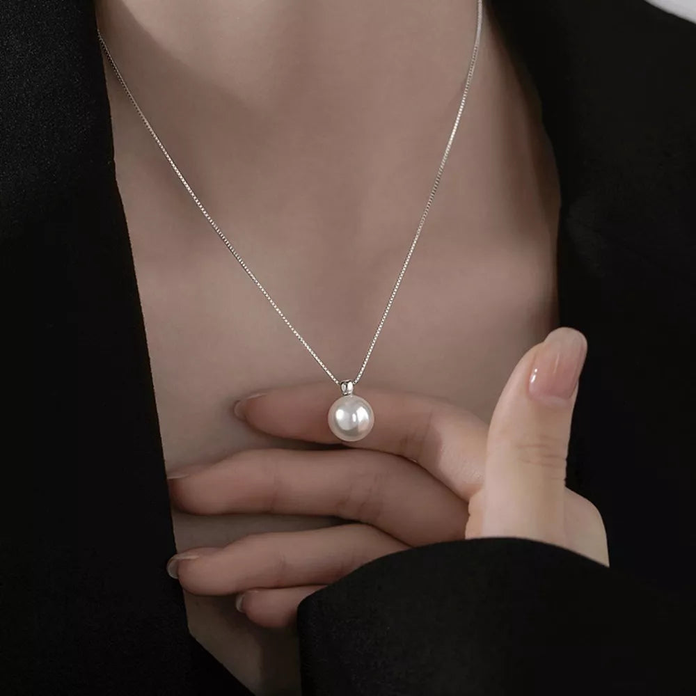 Synthetic Pearl,925 sterling silver Care instructions: Avoid wearing during exer necklace in silver with straight silhouette
