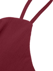 Burgundy spaghetti strap romper with textured fabric and bow-knot detail