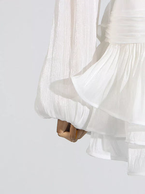 White ruffle mini dress with balloon sleeves and tiered skirt detail