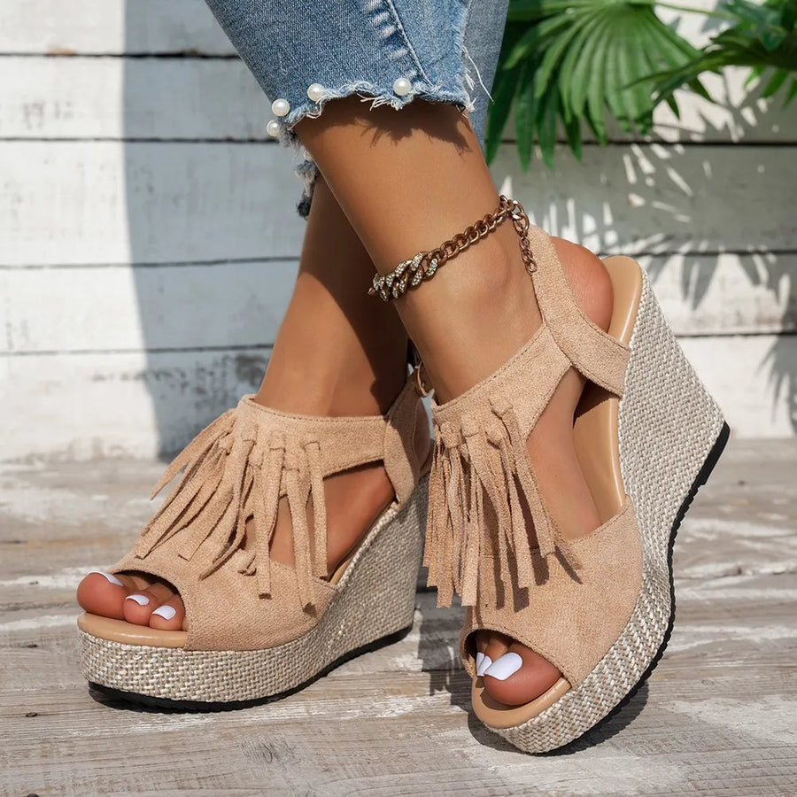 Khaki suede fringe espadrille wedges with ankle strap and woven platform.