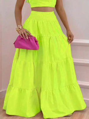 Lime ruffled crop top and tiered maxi skirt set with smocked waist detail.
