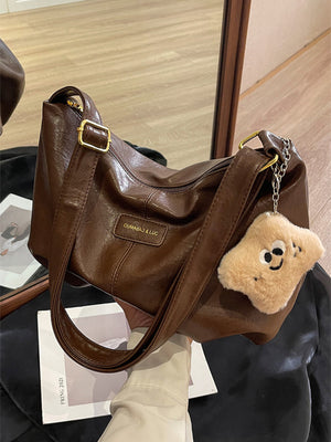 Medium brown pu leather crossbody bag with chain detail and star charm