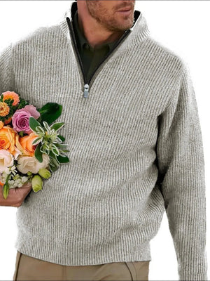 Textured ribbed quarter-zip sweater in gray with a quarter-zip neckline.