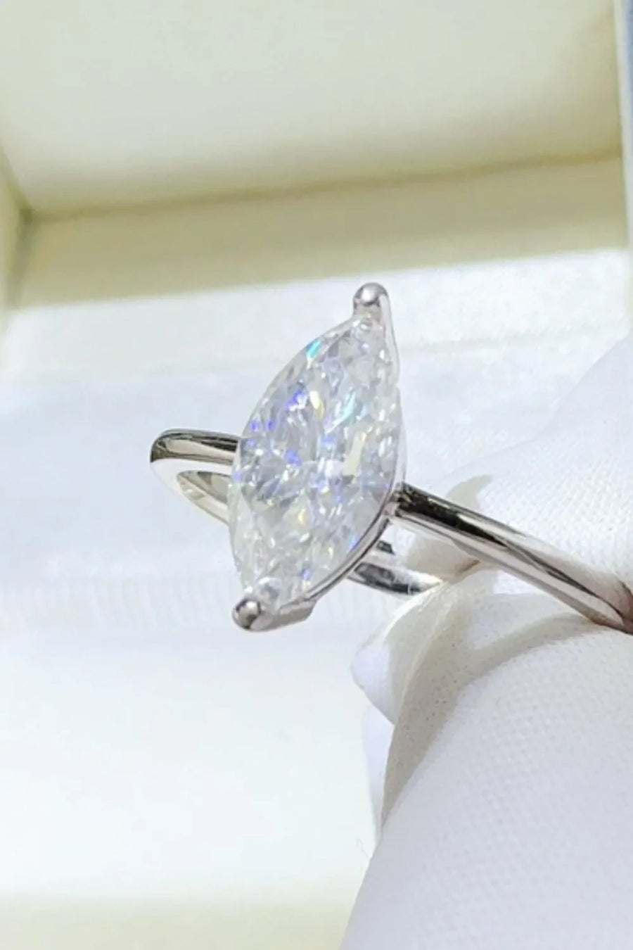 Sterling silver ring with a large marquise cut solitaire diamond.