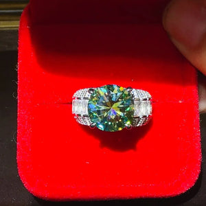 Silver band ring with large emerald cut moissanite and baguette side stones.