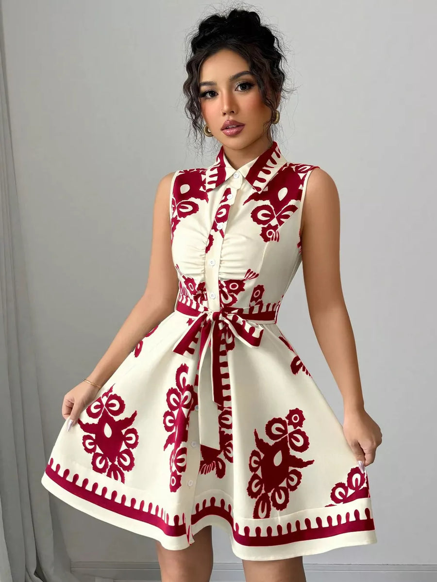 Cream and burgundy print sleeveless button-down dress with tie waist and a-line skirt