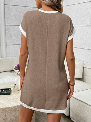 Ribbed knit mini dress in beige with white trim, short sleeves, and crew neck.