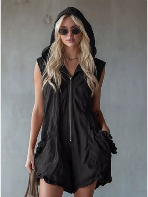 Black hooded sleeveless romper with ruffled pockets and zipper front.