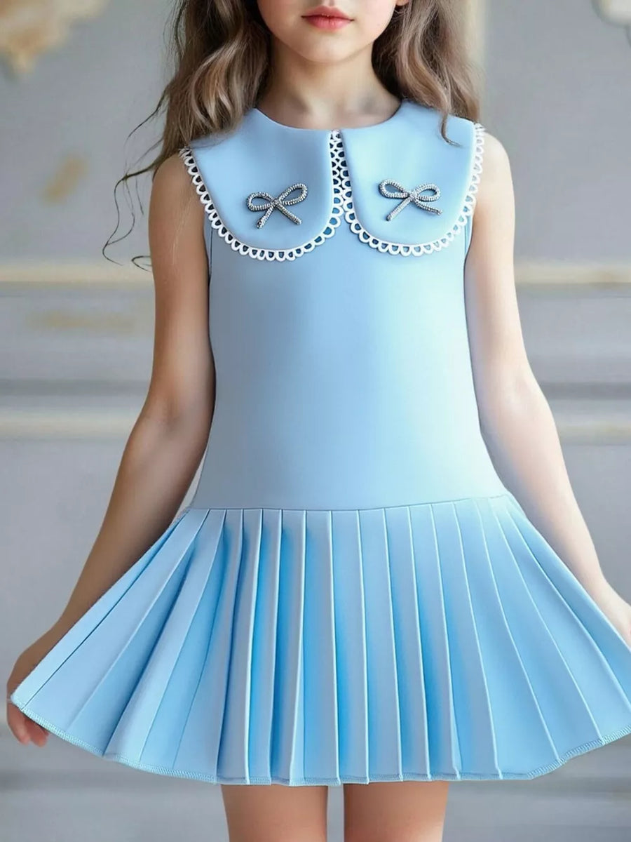 Blue toddler dress with lace collar, two bows, and pleated skirt