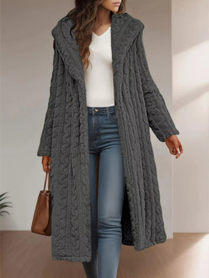 Gray hooded longline button up outerwear with textured pattern and button closure.