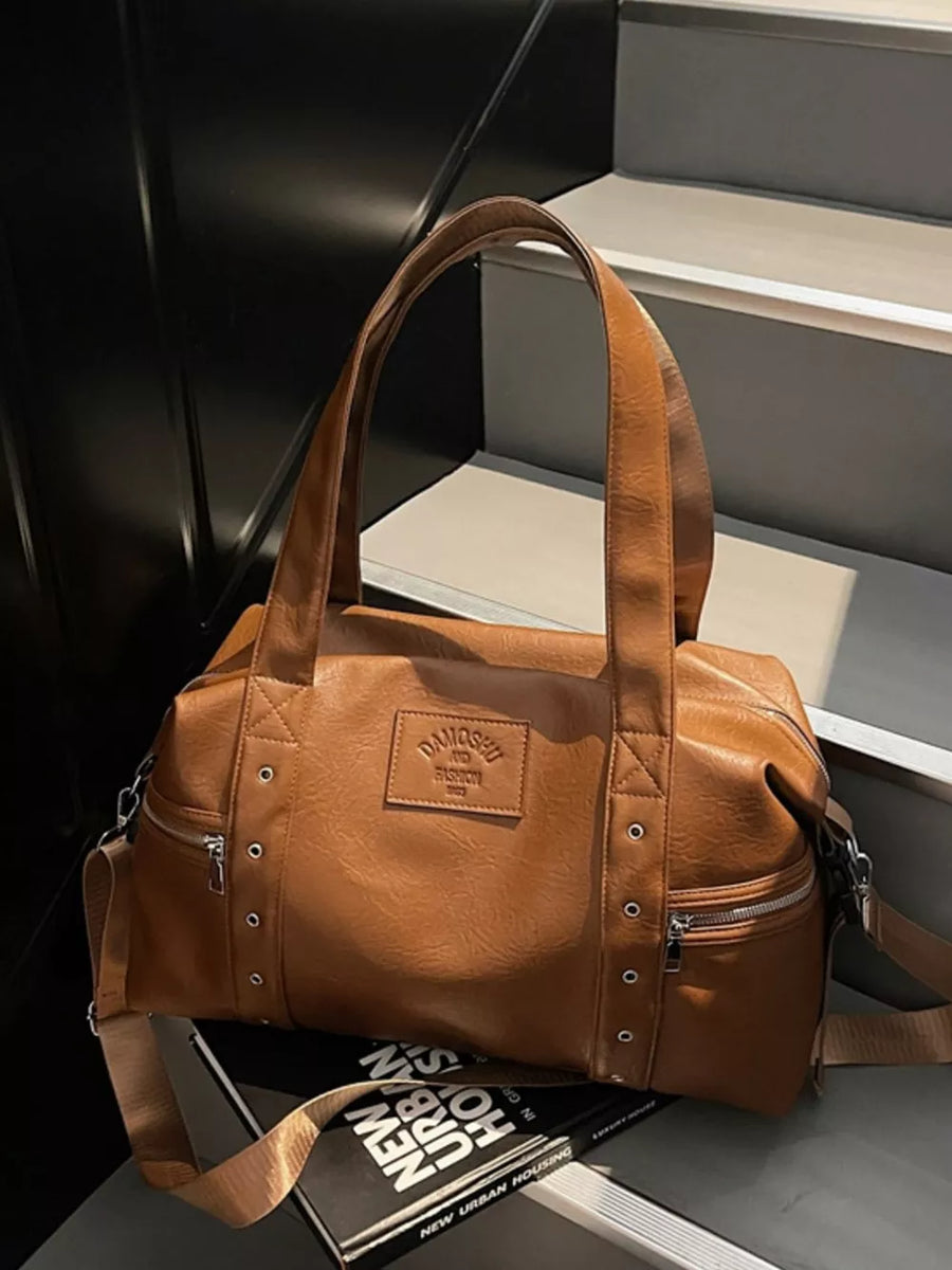 Chic medium brown pu leather shoulder bag with adjustable strap and silver hardware details.