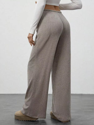 Mocha ribbed wide-leg pants with drawstring waist, shown from the back.