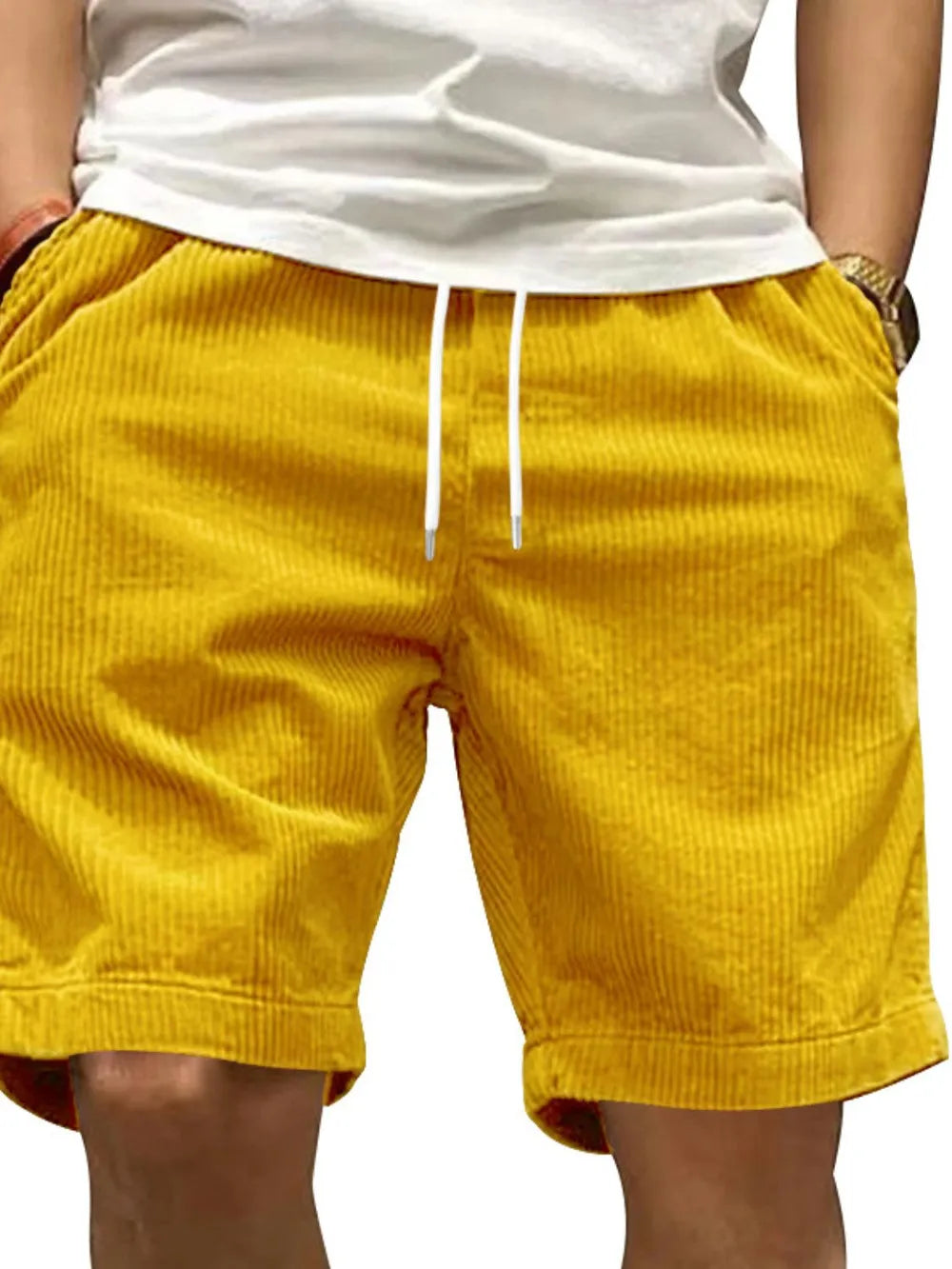 Gold corduroy drawstring shorts with relaxed fit and side pockets.