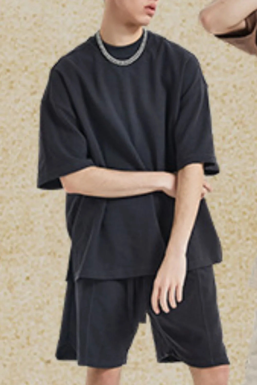 Black waffle knit boxy t-shirt with crew neck and short sleeves.