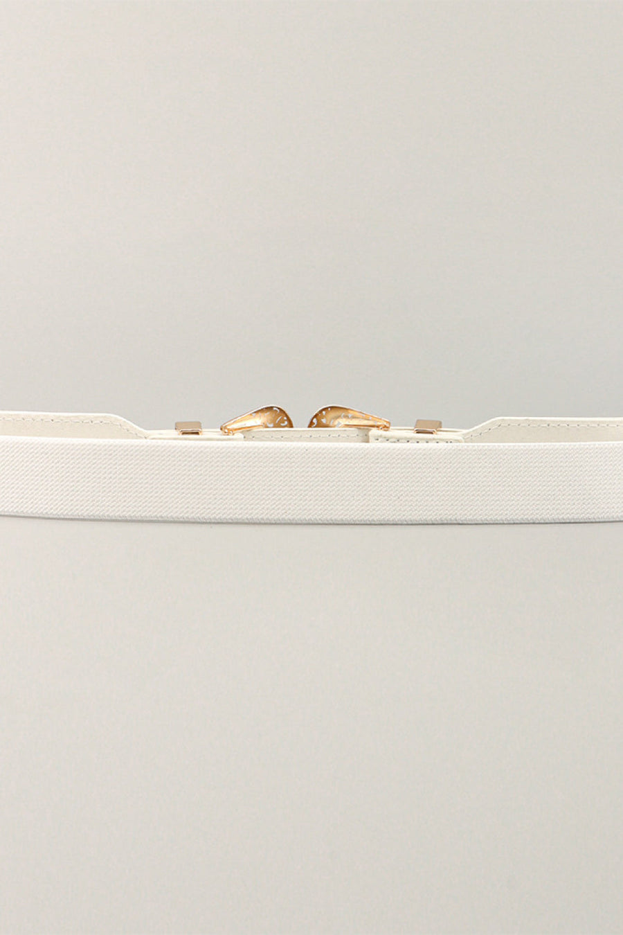 White elastic waist belt with western-style buckle and gold-tone accents