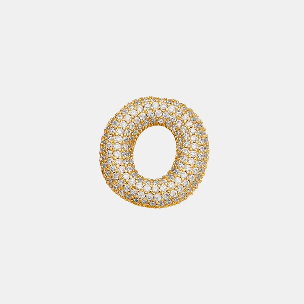 Puffed gold initial necklace encrusted with clear zirconia stones.