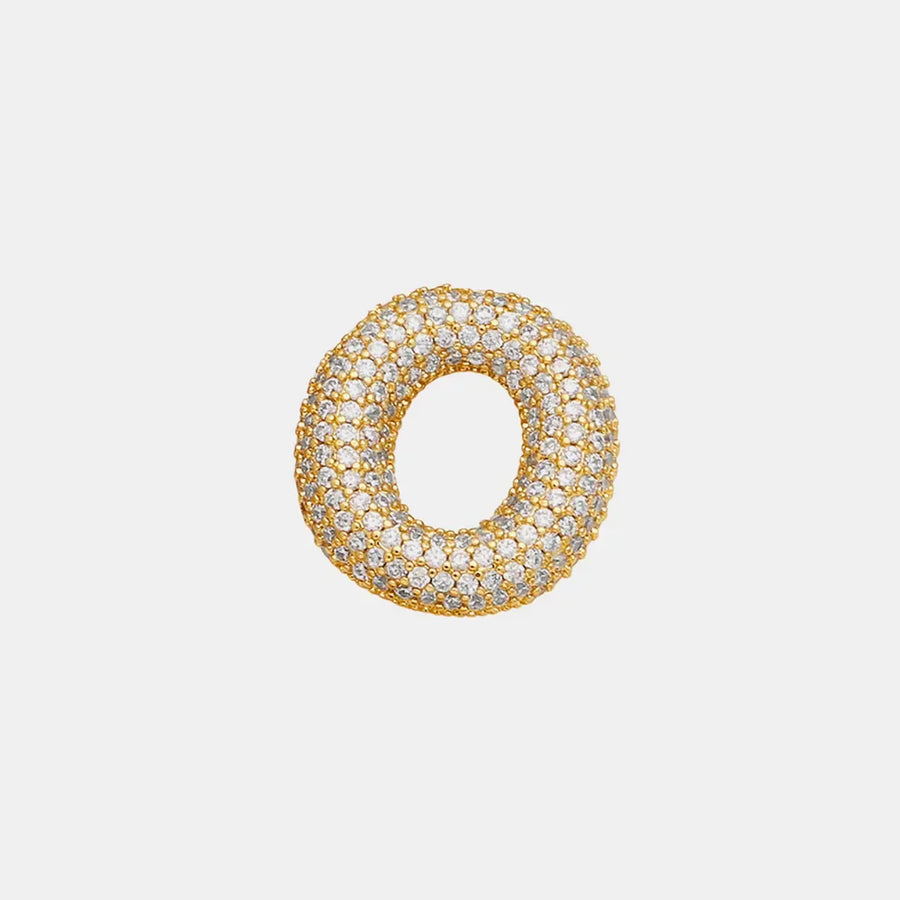 Puffed gold initial necklace encrusted with clear zirconia stones.