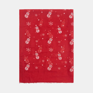 Red scarf with a festive snowman and snowflake print.