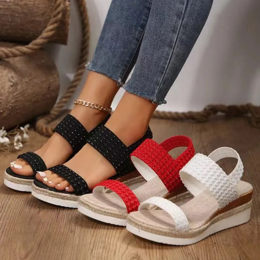 Textured strap espadrille wedge sandals in black, red, and white with a woven detail.