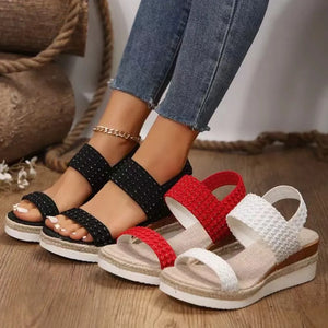 Textured strap espadrille wedge sandals in black, red, and white with a woven detail.
