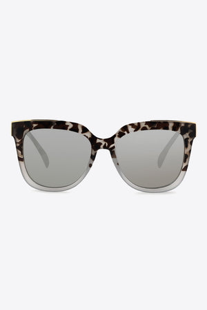 Leopard print angular frame sunglasses with silver lenses and clear temples.