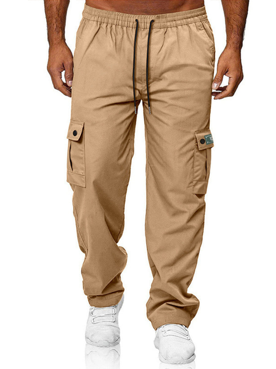 Khaki cargo pants with adjustable waist and button-flap side pockets.