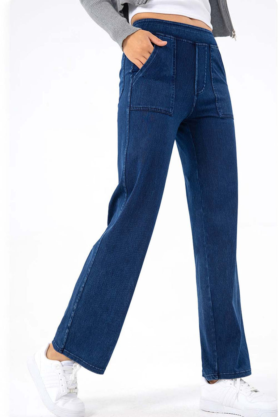 Dark wash denim jeans with utility pockets and a straight leg cut.