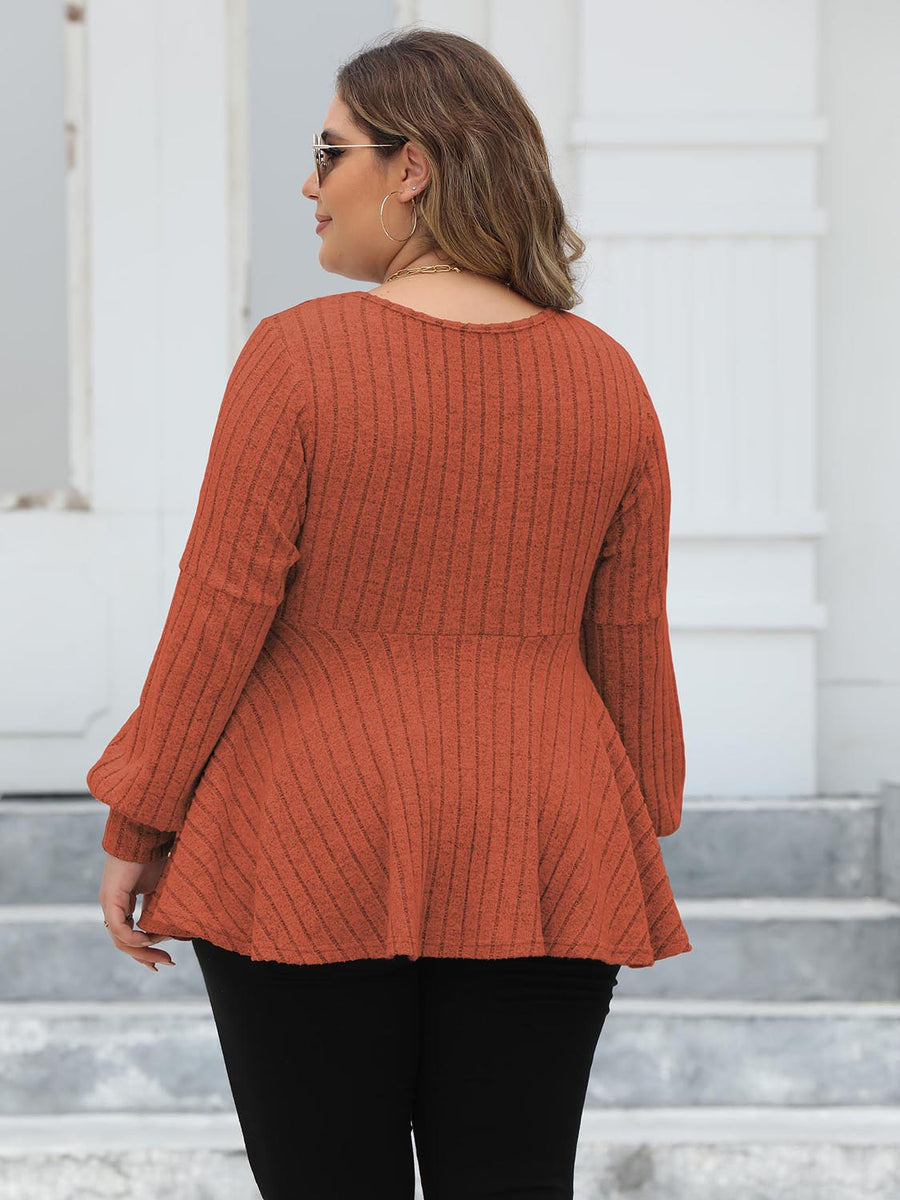 Ribbed peplum blouse in Red Orange with blouson sleeves.