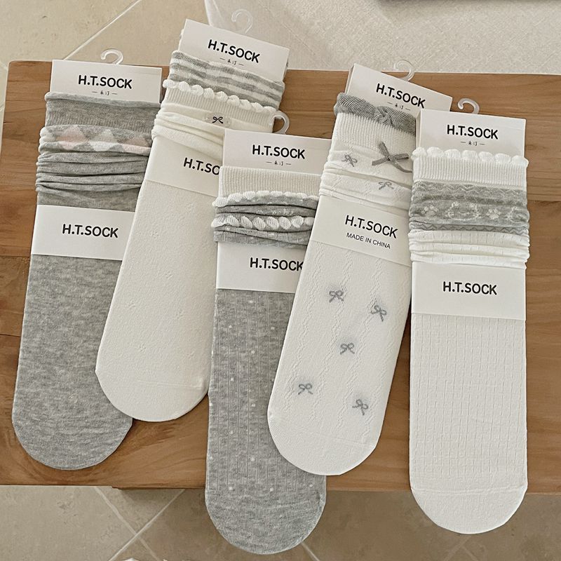 socks in white featuring ribbed knit and fitted fit