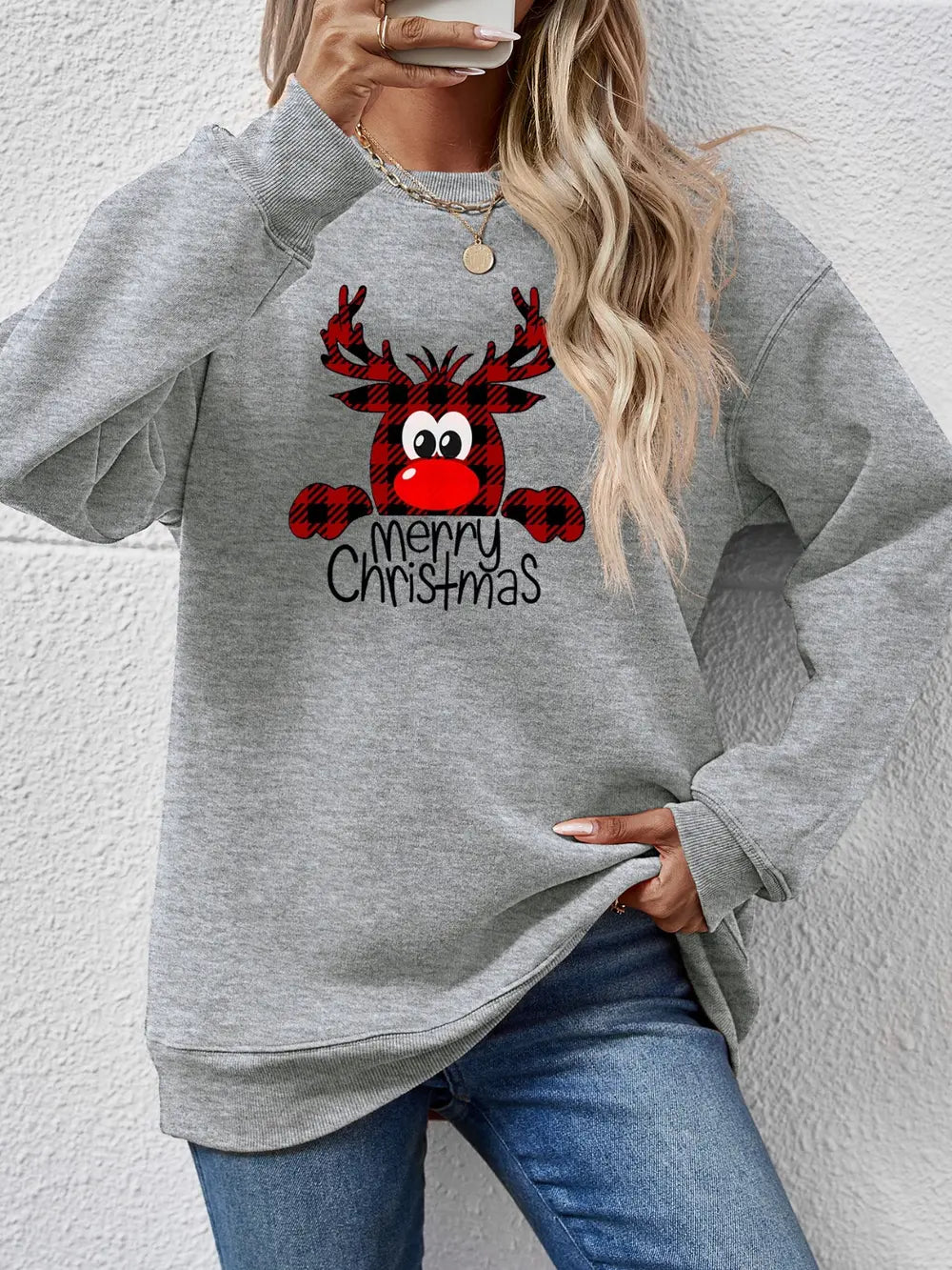 Grey crewneck sweatshirt with plaid reindeer graphic and Merry Christmas text.