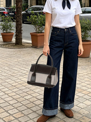 light beige handbag featuring structured and color-block