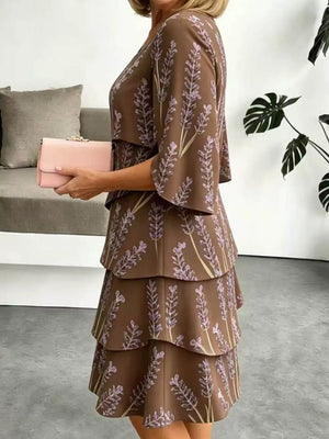 Brown floral tiered ruffle hem dress with flutter sleeves.
