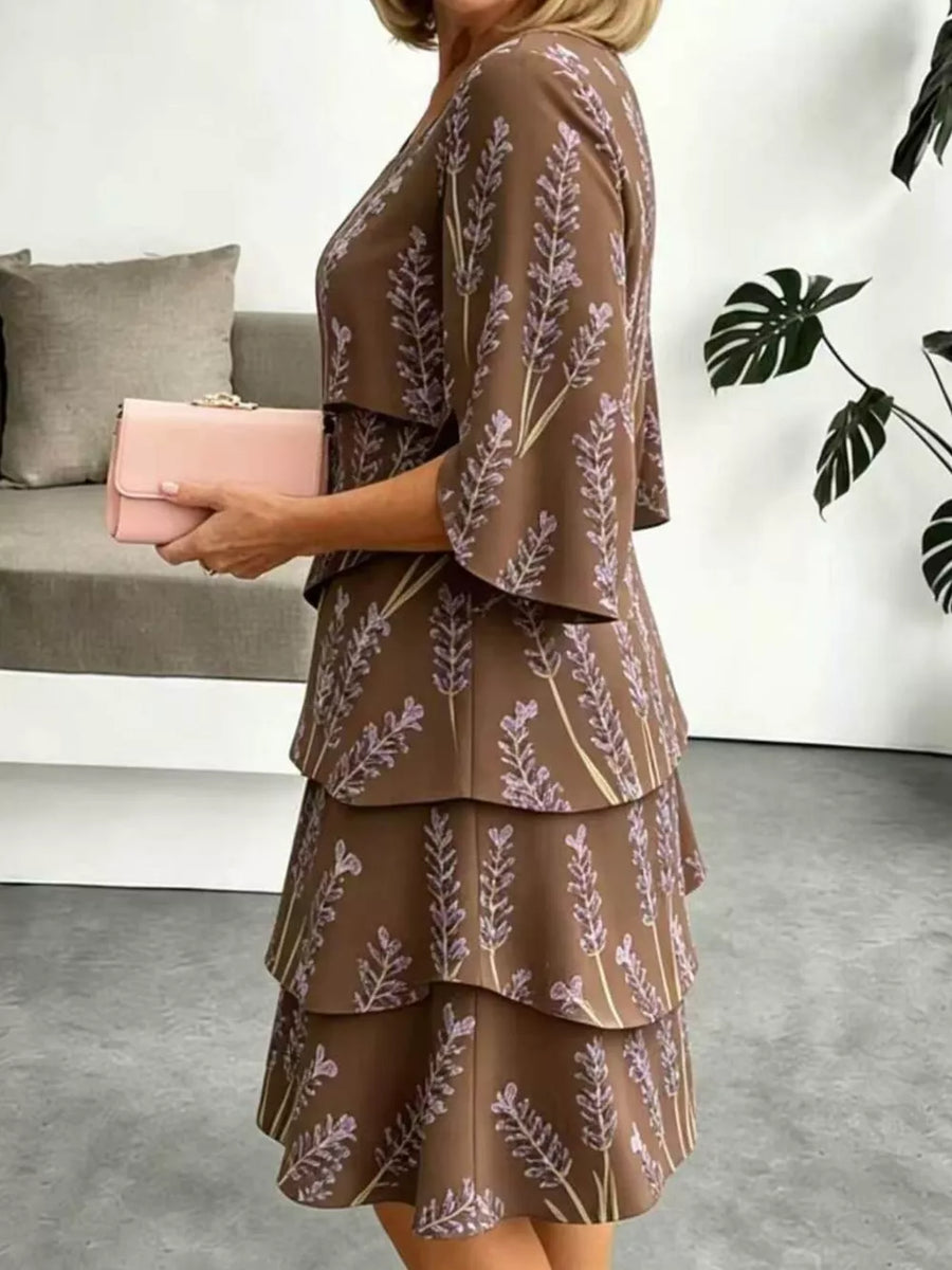Brown floral tiered ruffle hem dress with flutter sleeves.
