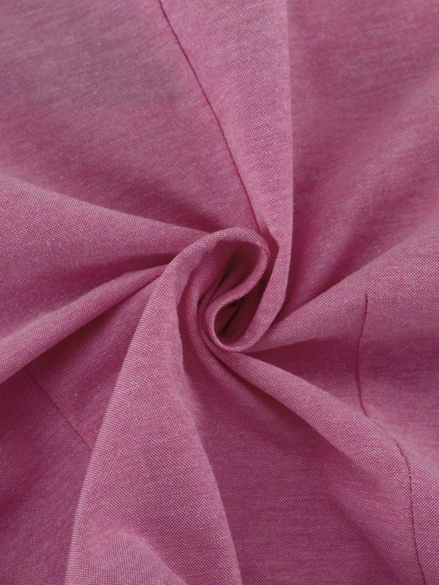 Pink textured fabric with a subtle weave.