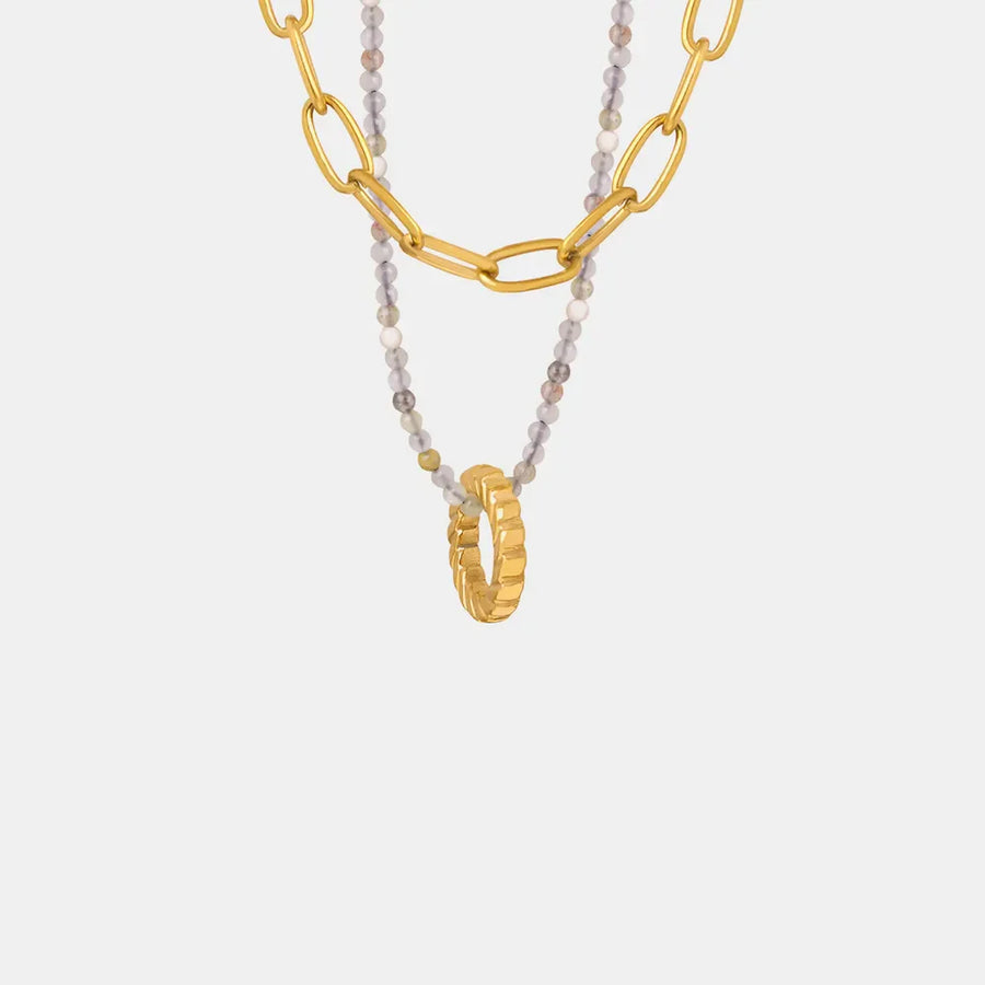 Gold layered chain necklace with beaded strand and ring pendant