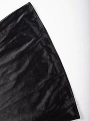 Black satin high-waisted skirt detail showing lustrous fabric texture.