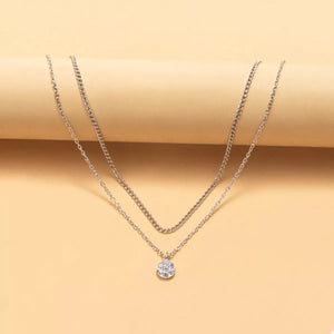 Silver double layered pendant necklace with a crystal flower charm