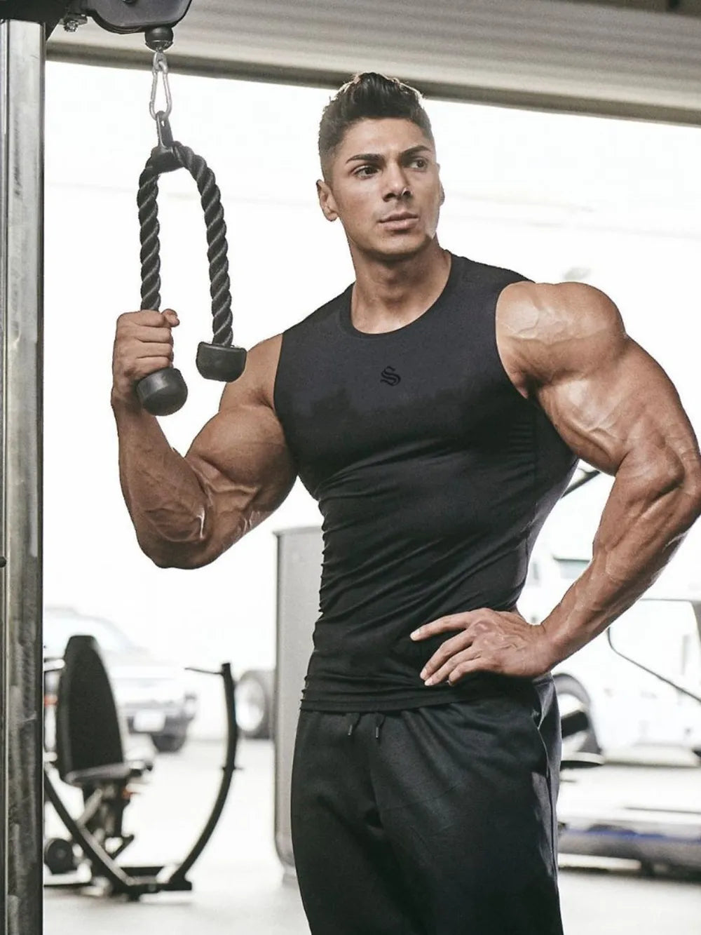 Black performance fit muscle tank top with crew neck and logo detail