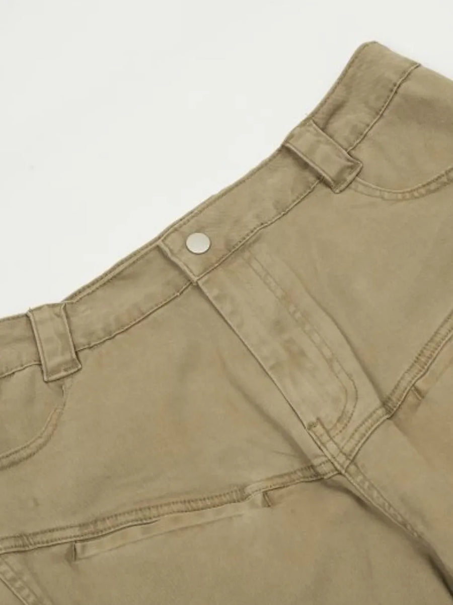 Khaki utility pleated wide-leg trousers with cargo pockets and button closure.
