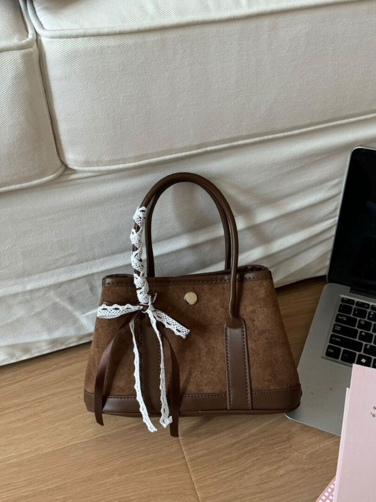 Brown suede tote bag with lace trim and ribbon detail