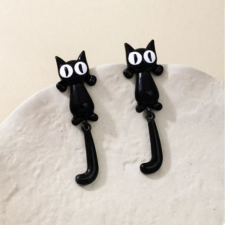 white earrings featuring dangle and novelty